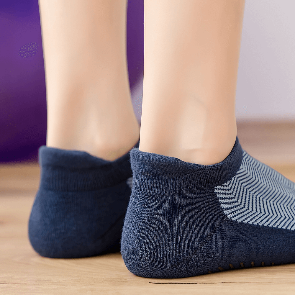 Women's non-slip breathable pilates socks in blue, showing back view and anti-slip grip for yoga, dance, and fitness.